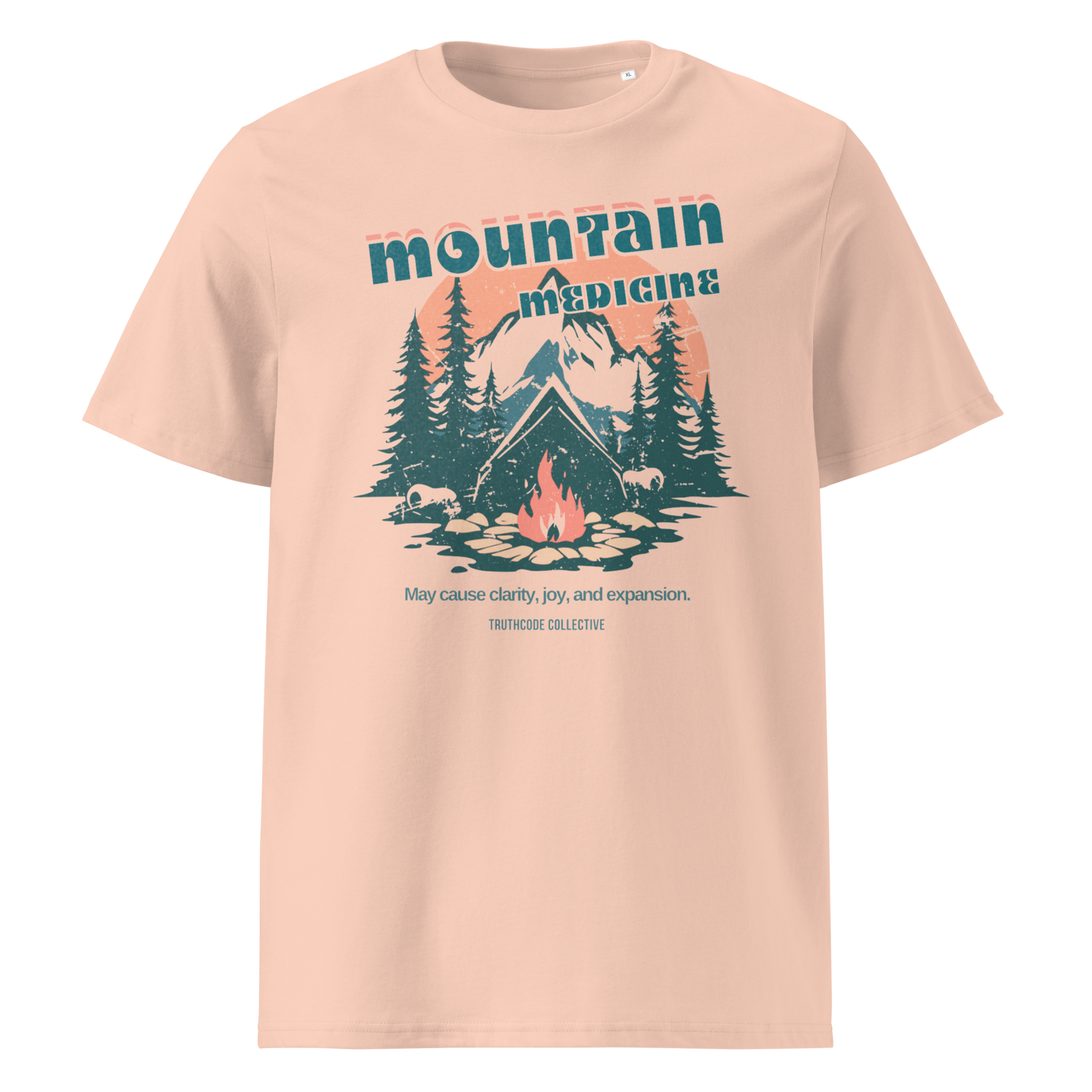 Peach organic t-shirt with mountain and campfire graphic and 'Mountain Medicine' text on a white background