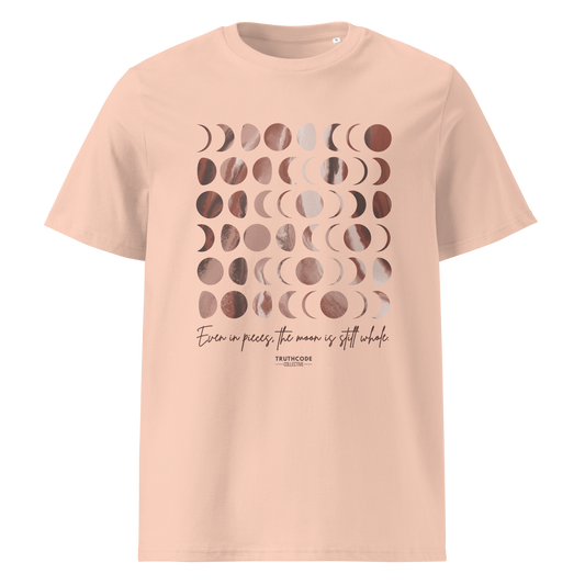 Peach organic t-shirt with rose gold moon phase design and text 'Even in pieces, the moon is still whole' on a white background