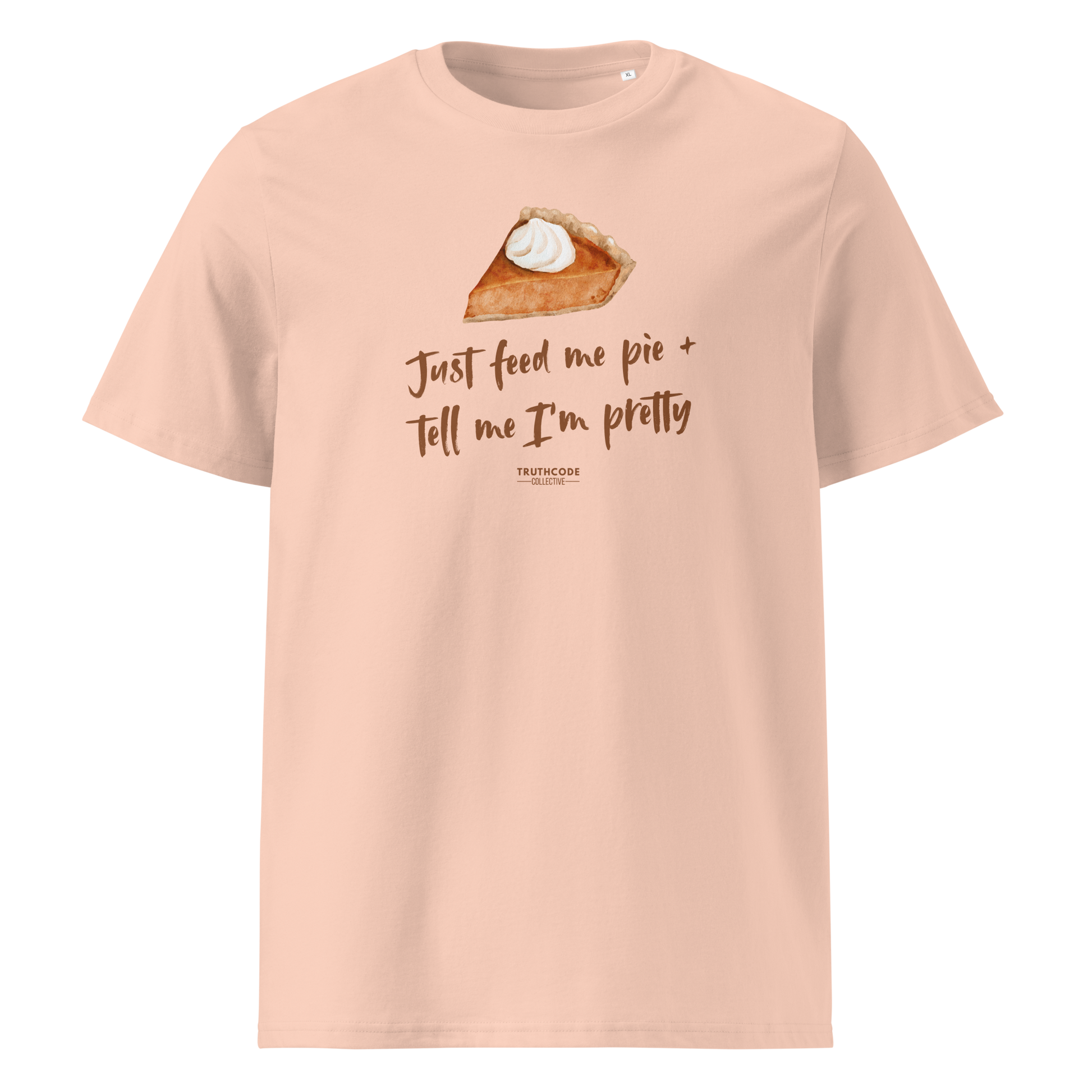 Peach organic t-shirt with a pie graphic and text 'Just feed me pie + tell me I'm pretty' on a white background