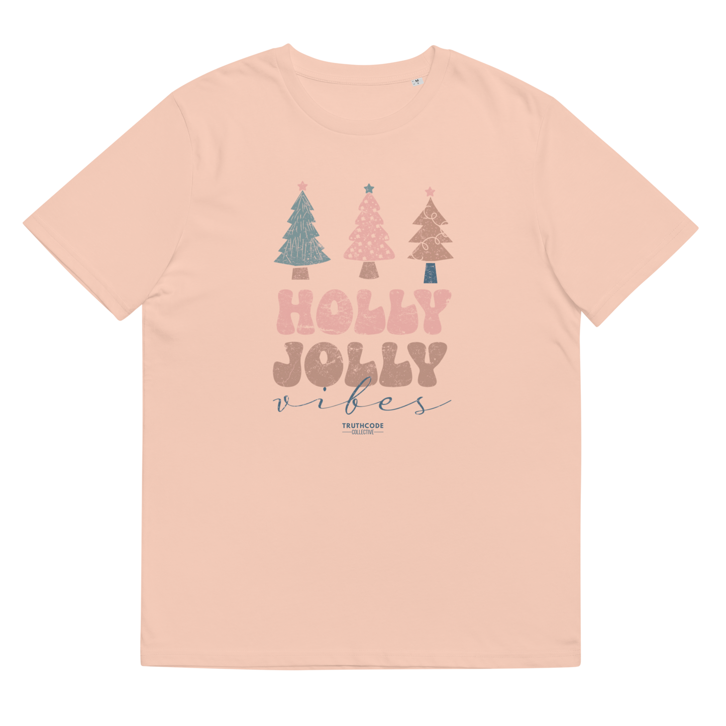 Pink t-shirt with Christmas tree design and 'Holly Jolly Vibes' text on a white background