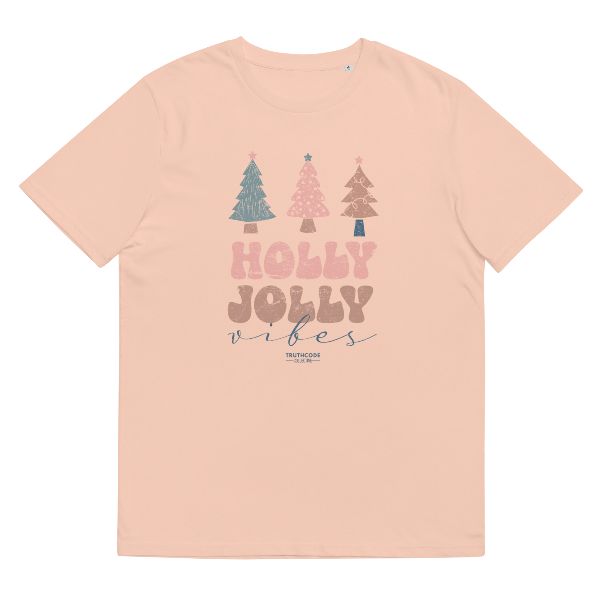 Pink t-shirt with Christmas tree design and 'Holly Jolly Vibes' text on a white background