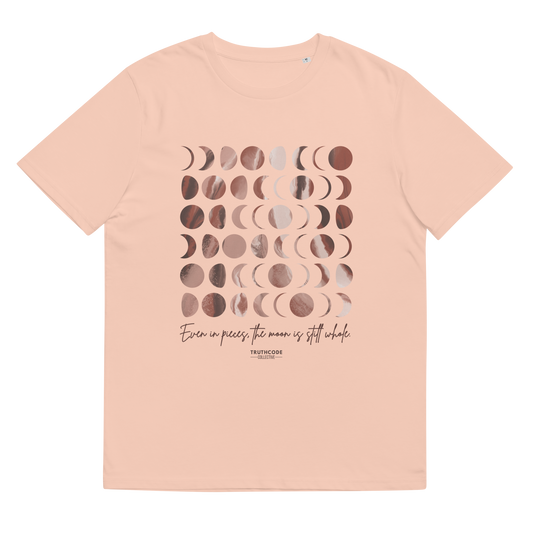 Peach organic t-shirt with rose gold moon phase design and text 'Even in pieces, the moon is still whole', shirt on a white background