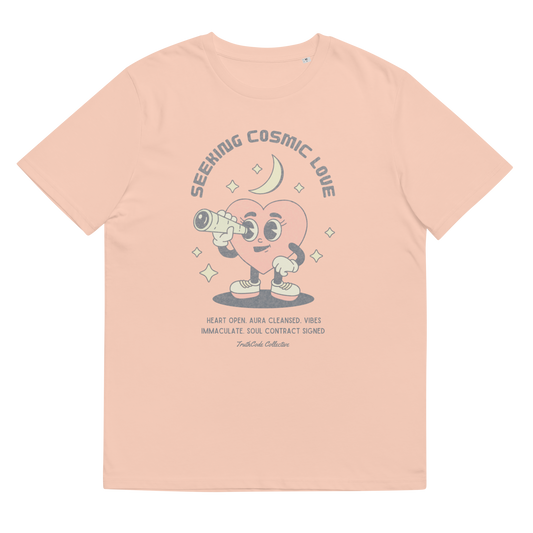 Peach organic t-shirt with a heart-shaped character holding a telescope and text 'Seeking Cosmic Love' on a white background.