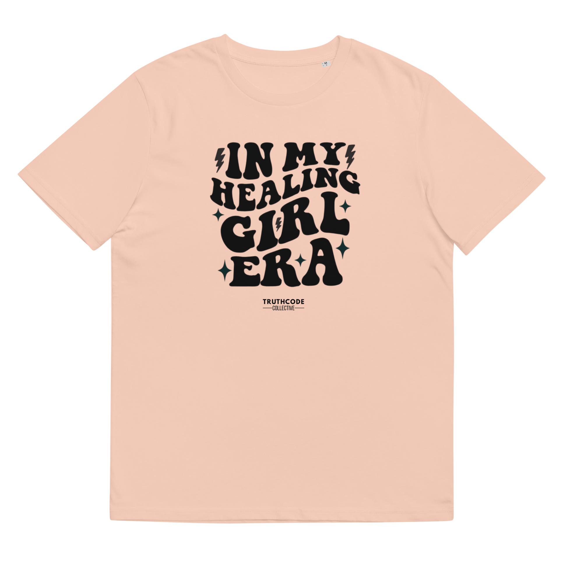 Peach organic t-shirt with black text 'IN MY HEALING GIRL ERA' on a white background
