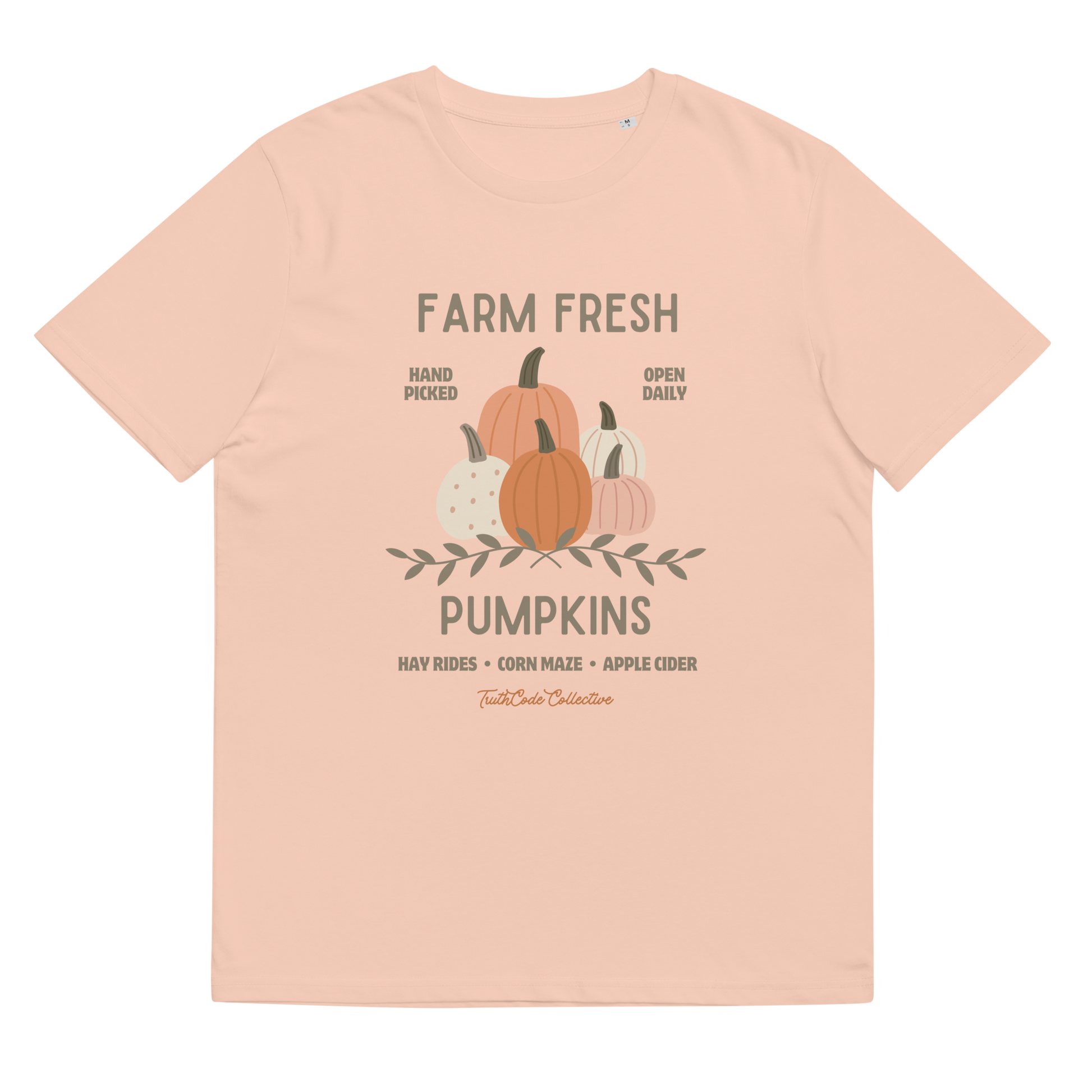 Peach organic t-shirt with pumpkin graphic and text 'Farm fresh pumpkins, hay rides, corn maze, apple cider'  on a white background