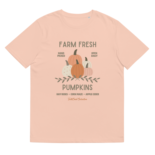 Peach organic t-shirt with pumpkin graphic and text 'Farm fresh pumpkins, hay rides, corn maze, apple cider'  on a white background