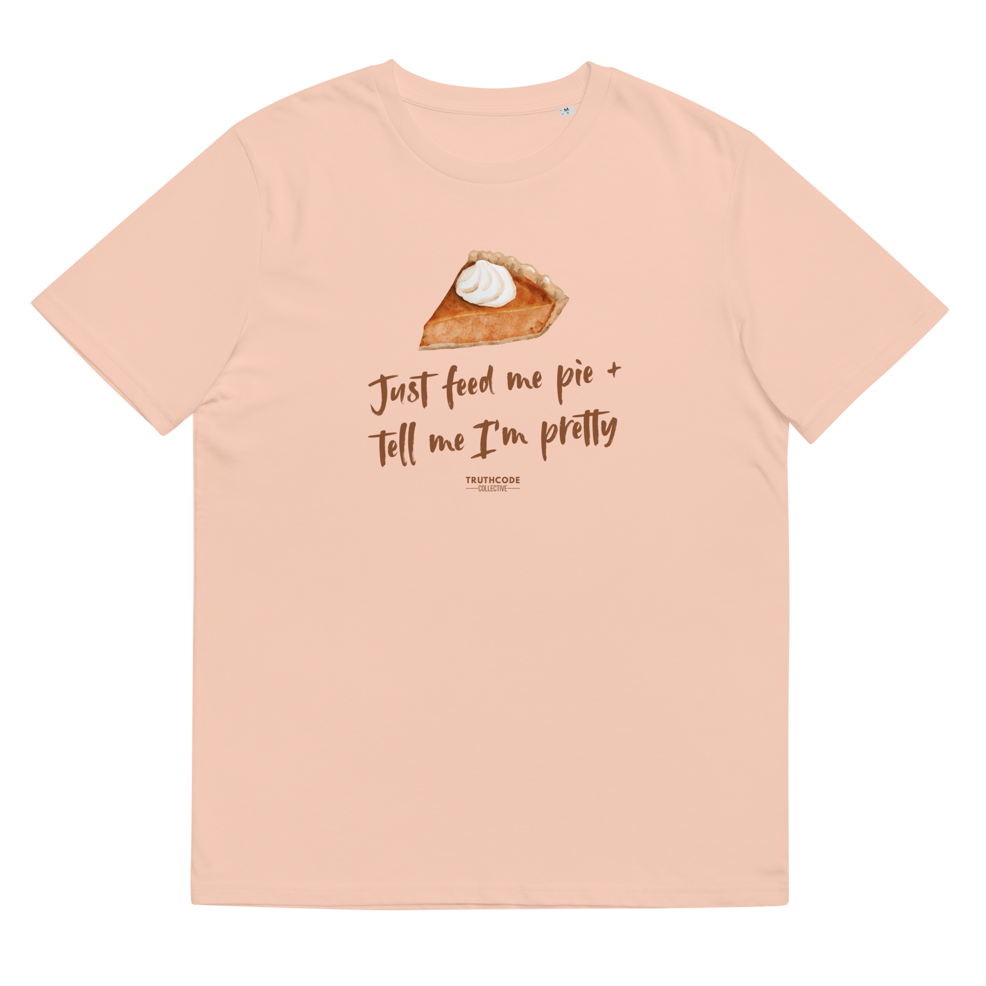 Peach organic t-shirt with a pie graphic and text 'Just feed me pie + tell me I'm pretty'