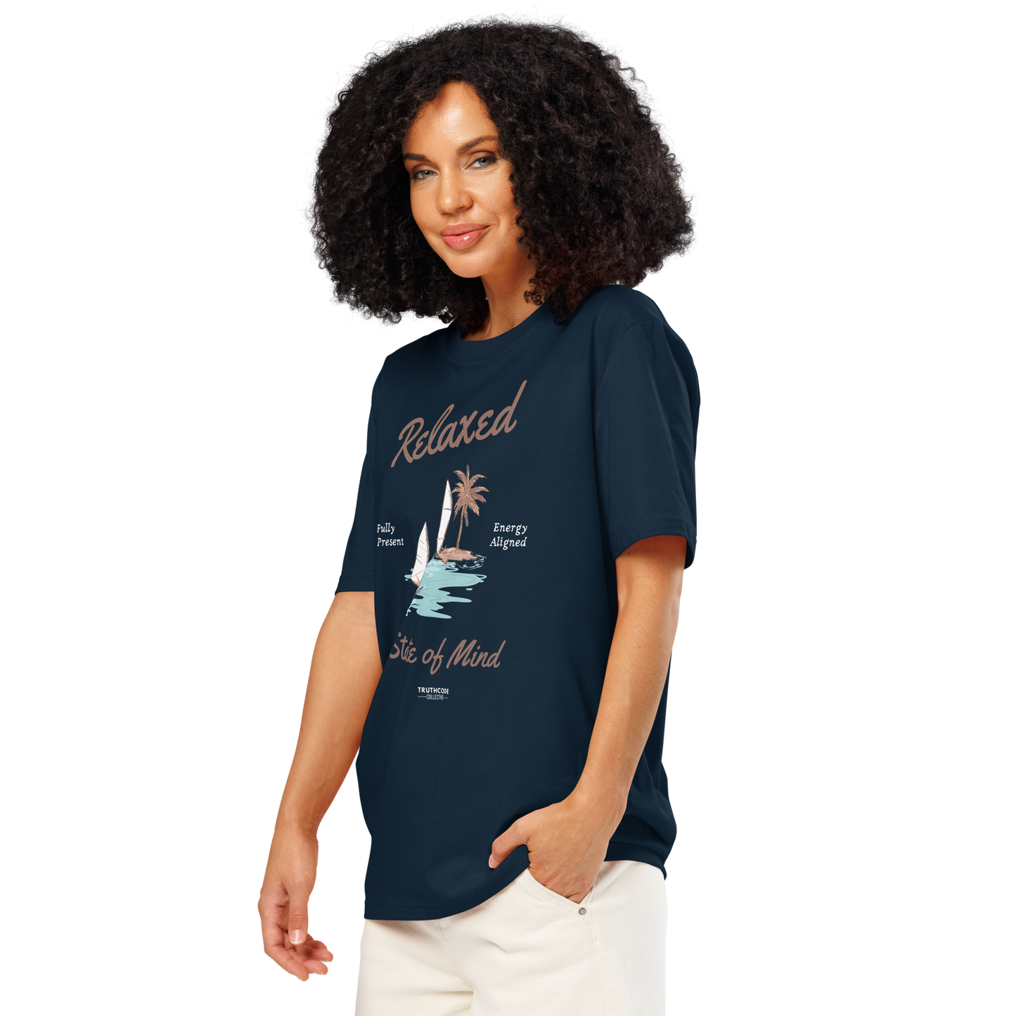 Woman wearing navy blue organic t-shirt with a sailboat graphic and text 'Relaxed state of mind', on a white background