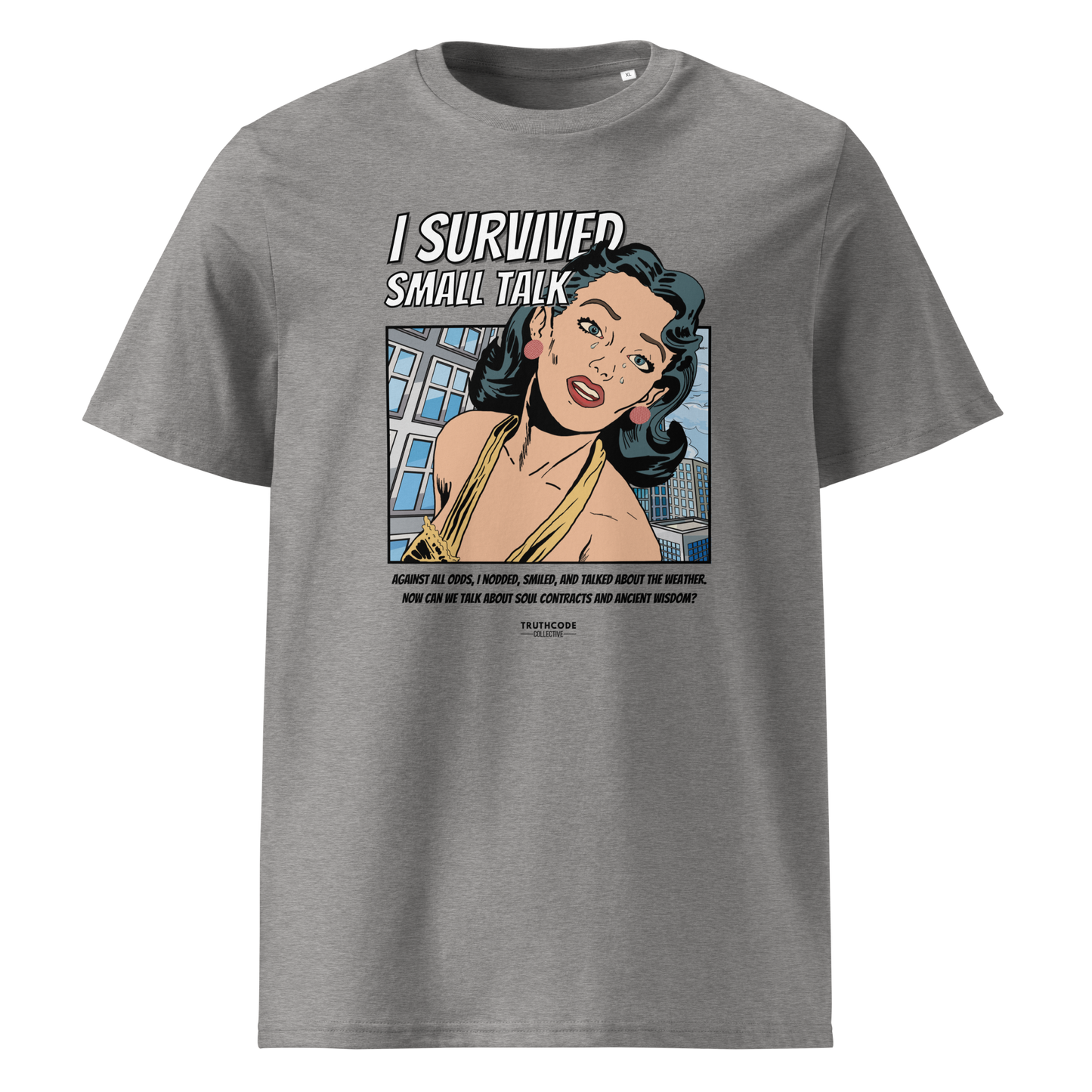 Gray organic t-shirt with a graphic design featuring a comic cartoon woman and text with lighthearted saying 'I SURVIVED SMALL TALK' on a white background