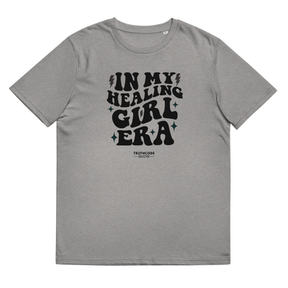 Gray organic t-shirt with black text 'IN MY HEALING GIRL ERA' on a white background