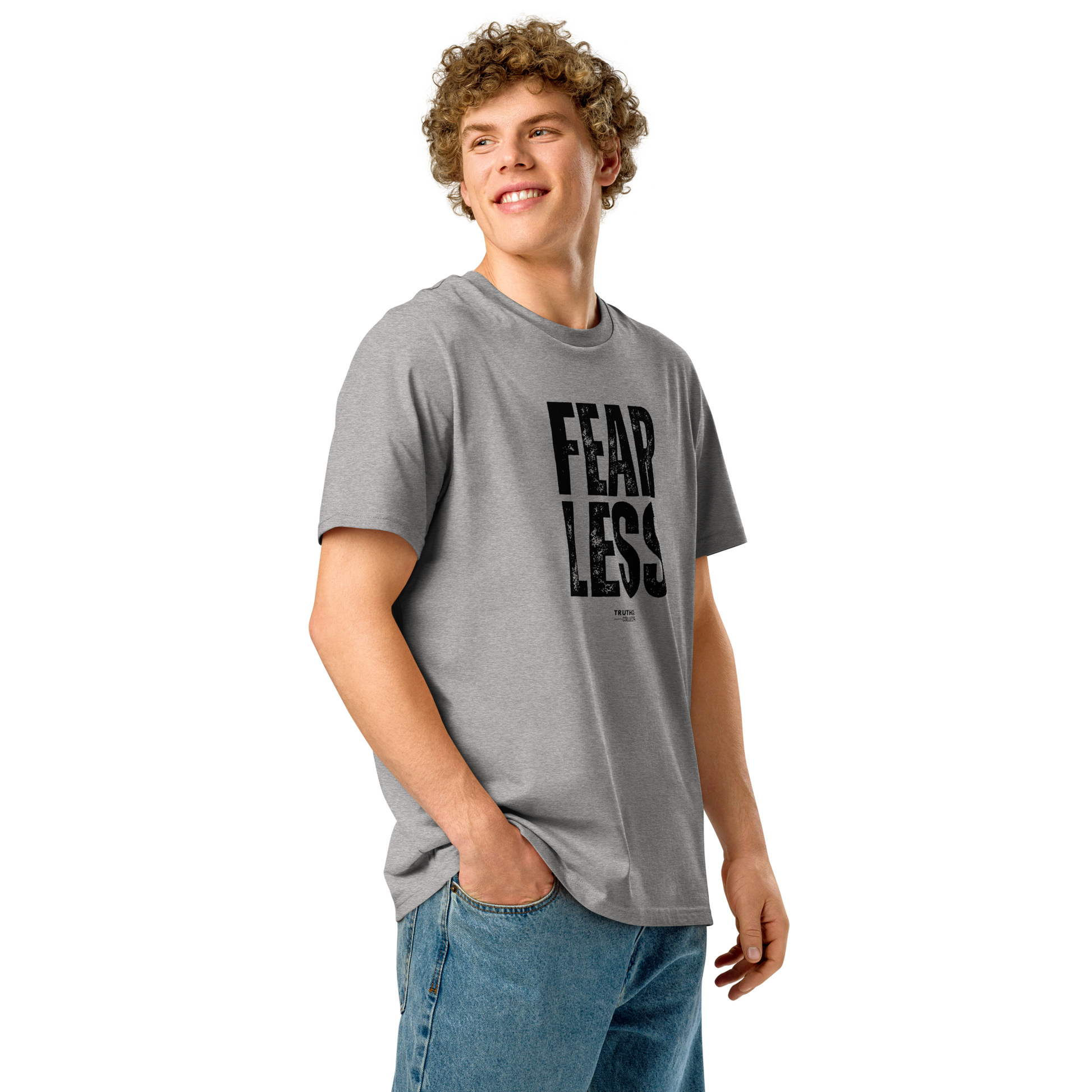 Guy wearing a gray organic t-shirt with 'FEAR LESS' text on a white background