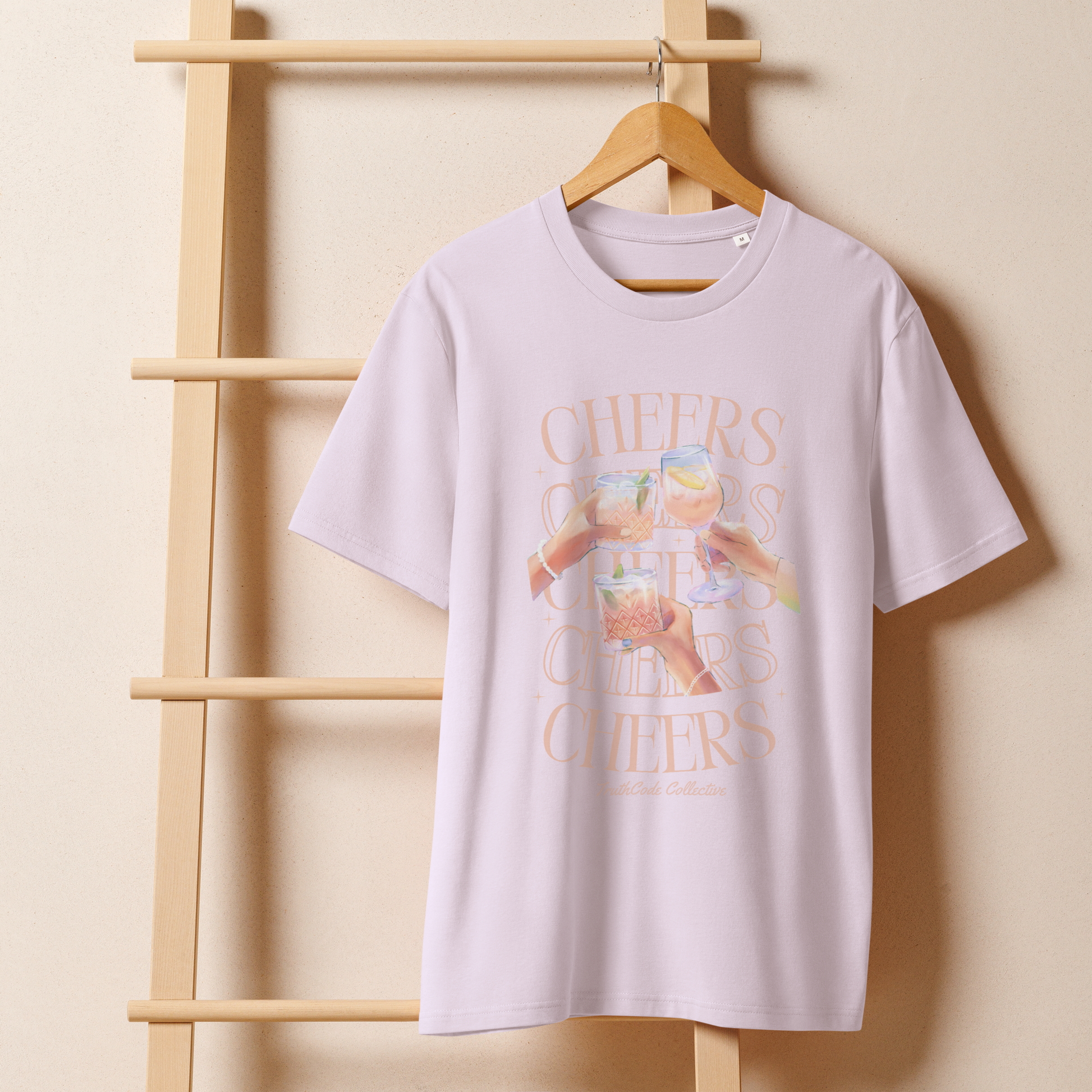 Lavender organic t-shirt with watercolor style floral and sun design and text 'Be the Light' hanging on a wooden hanger