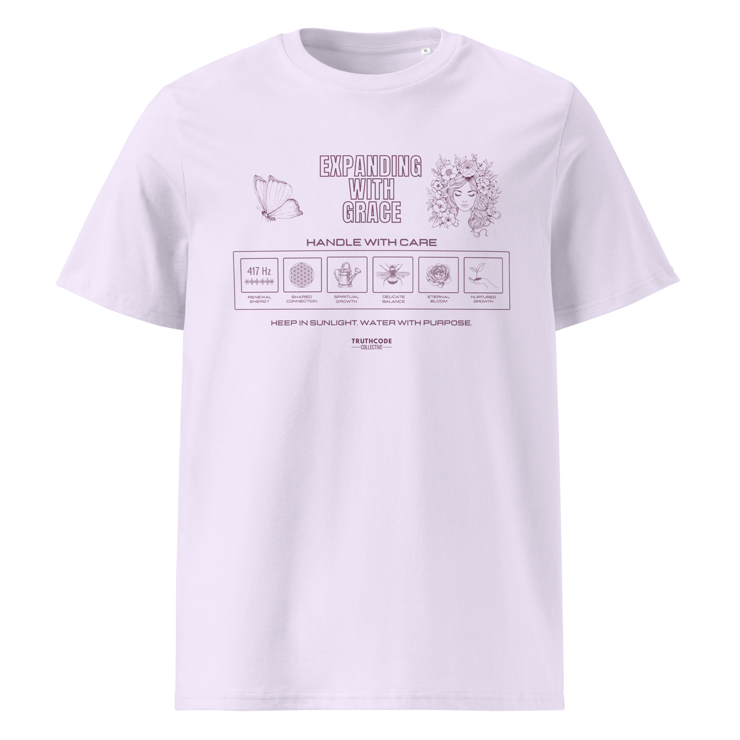 Lavender organic t-shirt with text 'Expanding with grace' with symbols and graphics relating to it on a white background