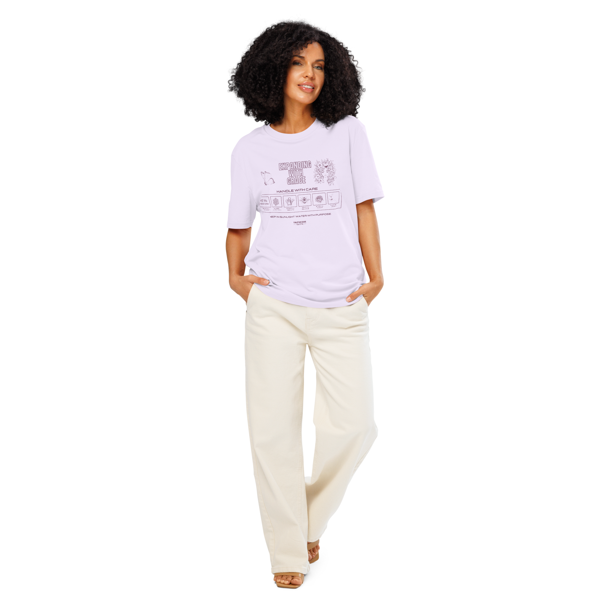 Woman wearing lavender organic t-shirt with text 'Expanding with grace' with symbols and graphics related to it on a white background