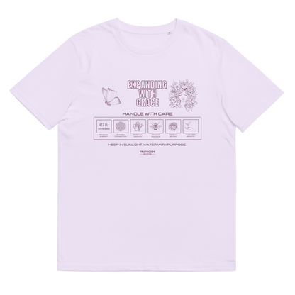 Lavender organic t-shirt with text 'Expanding with grace'  and symbols relating to expanding in laundry tag style graphics on a white background