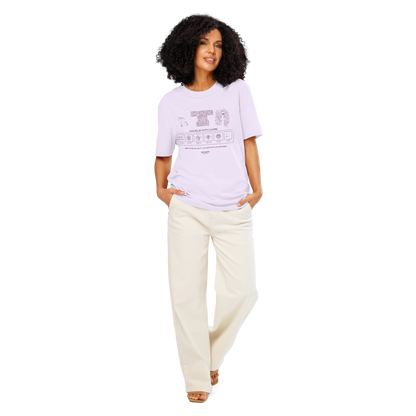 Woman wearing lavender organic t-shirt with text 'Expanding with grace'  and symbols relating to expanding in laundry tag style graphics on a white background