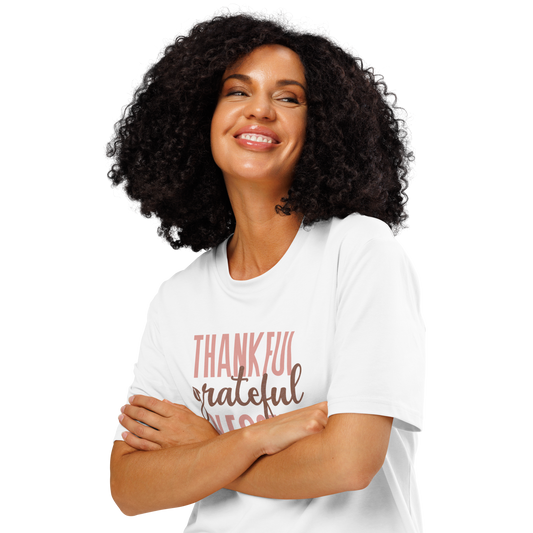 Woman wearing white organic t-shirt with 'Thankful grateful BLESSED' text on a white background