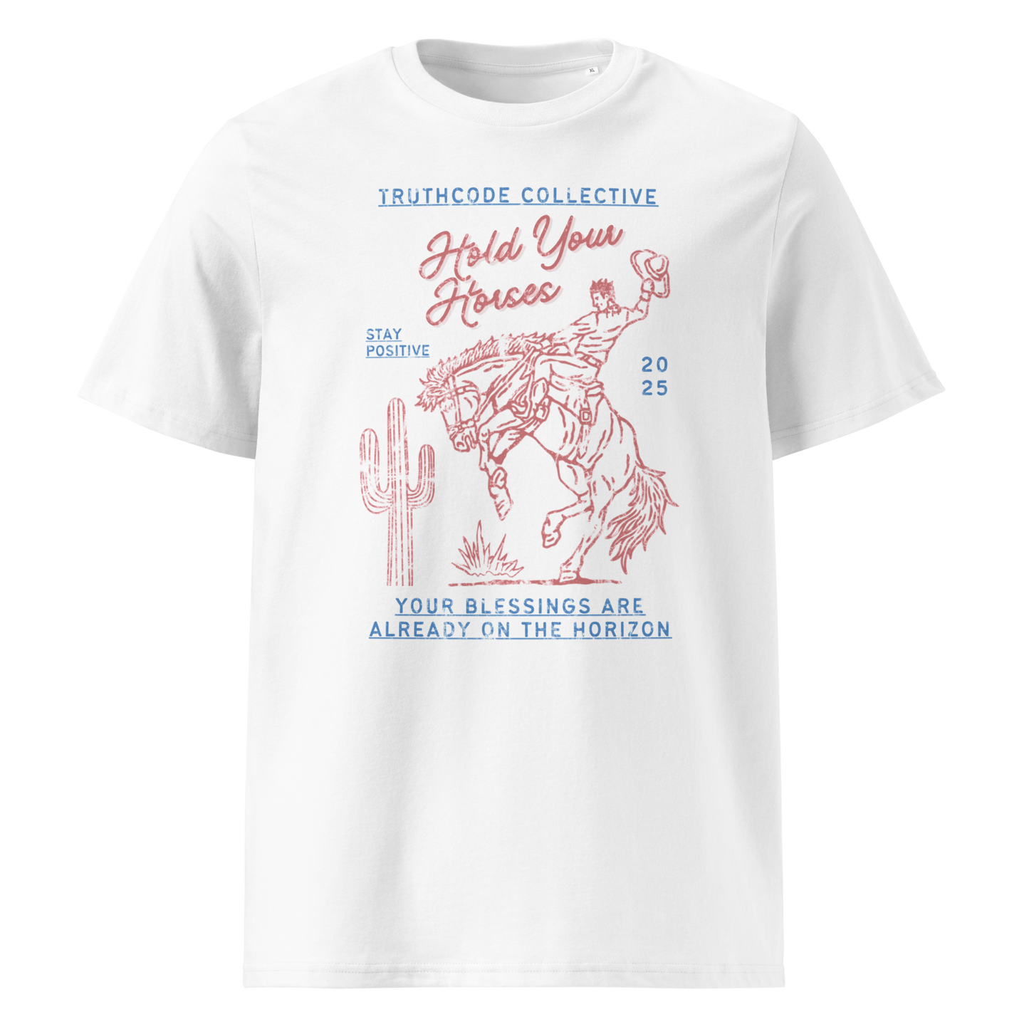 White organic t- shirt with a western style graphic of a cowboy on a bucking bronco, with the text 'Hold your horses, your blessings are already on the horizon'