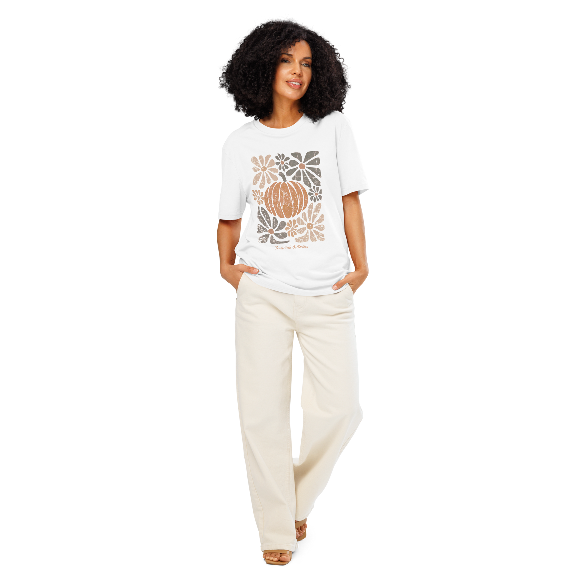 Woman wearing a white organic t-shirt with a pumpkin and floral design on a white background