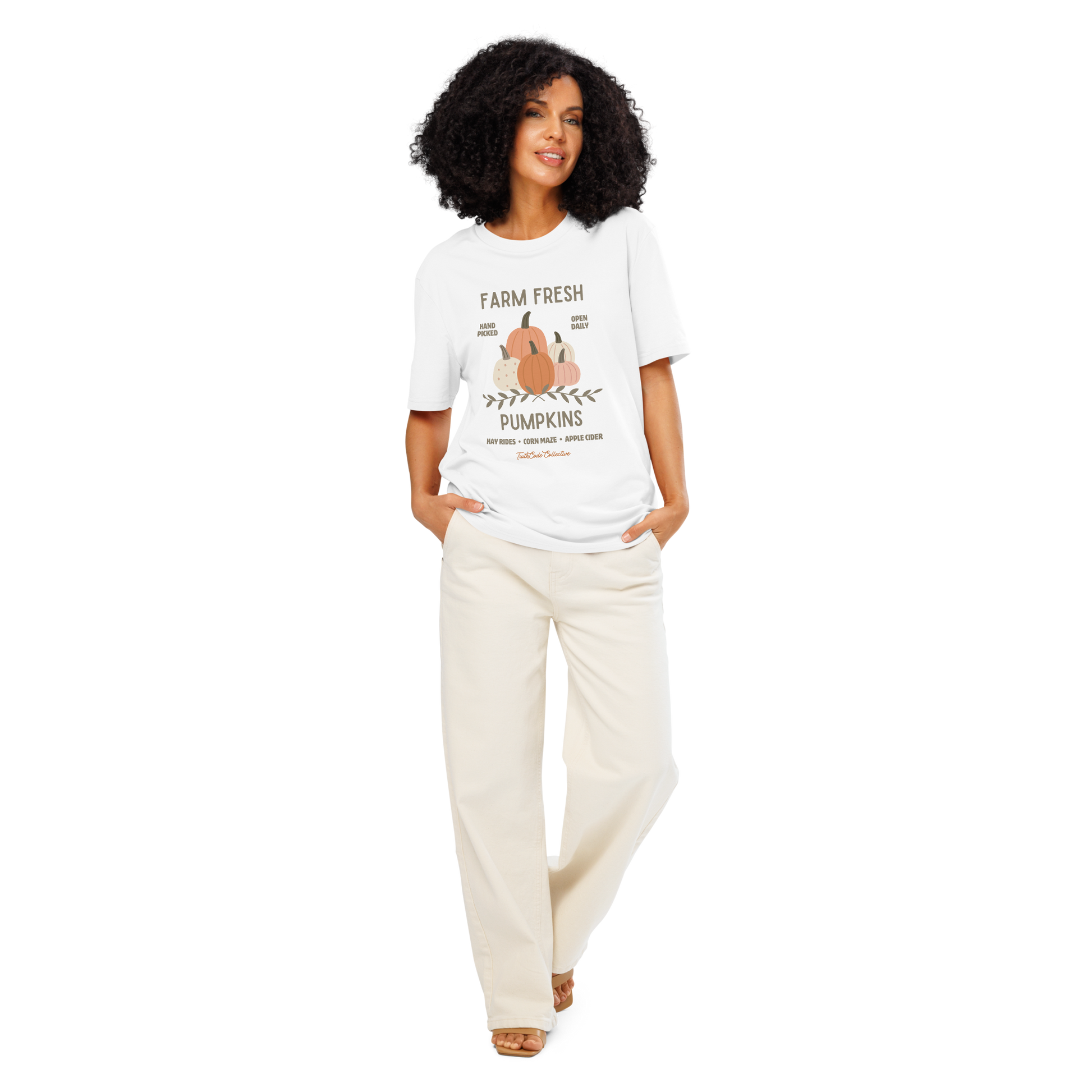 Woman wearing white organic t-shirt with 'Farm Fresh Pumpkins' text and pumpkin graphic design on a white background
