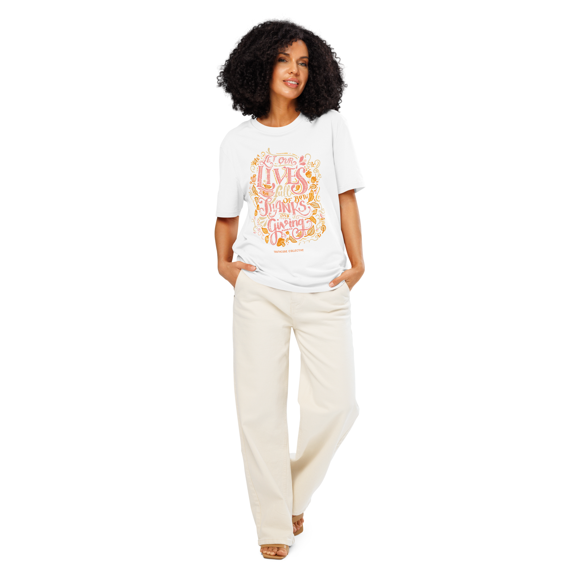 Woman wearing white organic t-shirt with colorful text design 'Let our lives be full of both thanks and giving' on a white background
