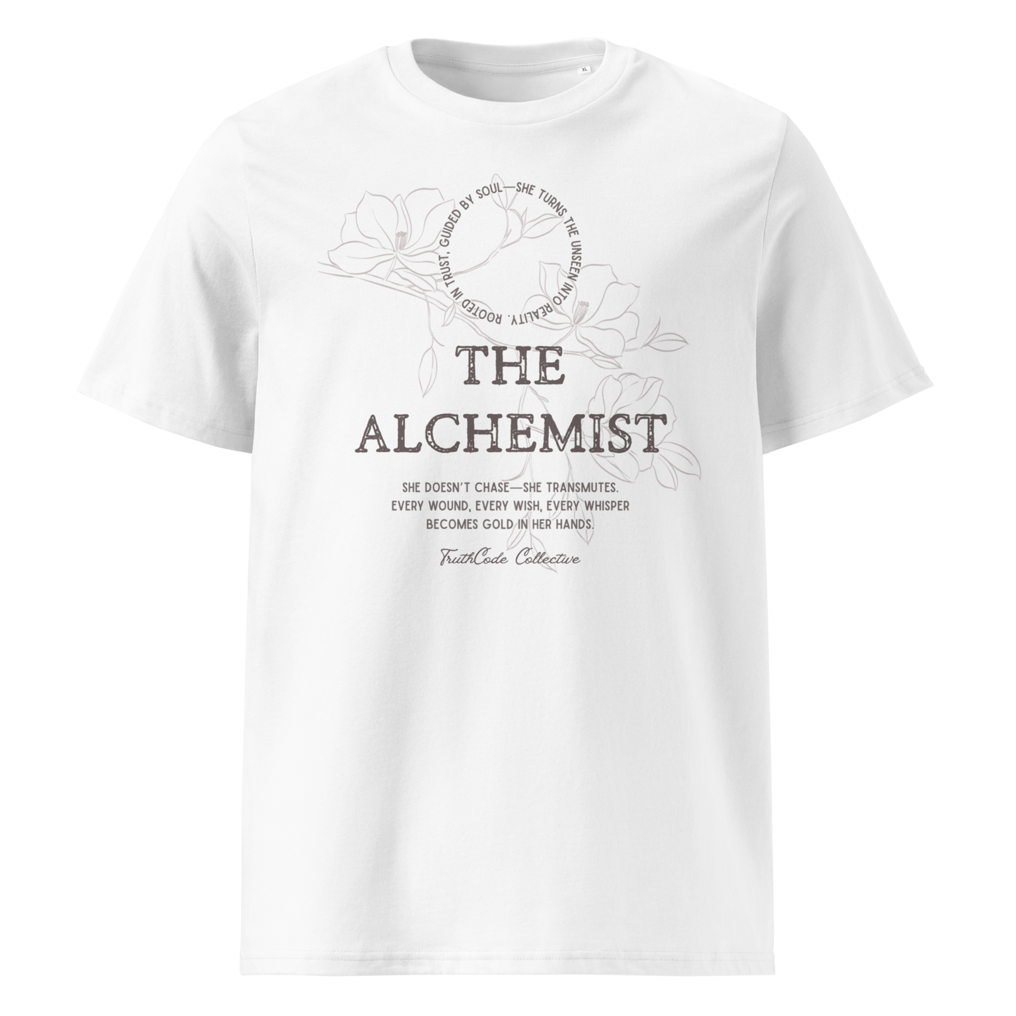 White organic t-shirt with text 'The Alchemist, she doesn't chase- she transmutes...' and subtle floral background design