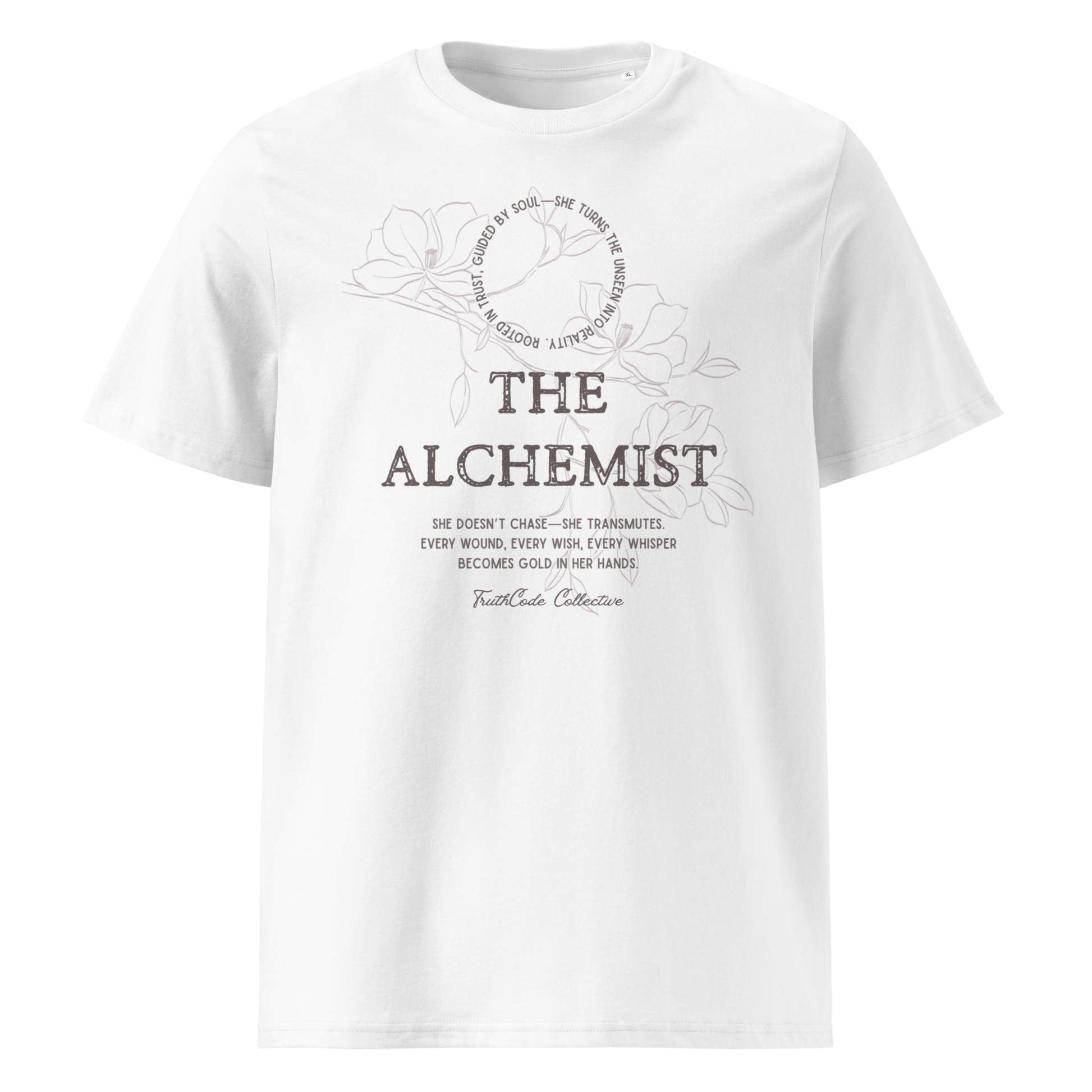 White organic t-shirt with text 'The Alchemist, she doesn't chase- she transmutes...' and subtle floral background design