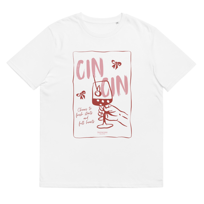 White organic t-shirt with text 'Cin Cin, cheers to fresh starts and full hearts' graphic design  of a glass, on a white background