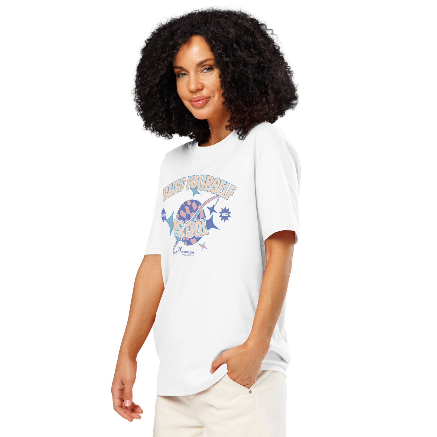 Woman wearing white organic t-shirt with a colorful graphic and text 'Being Yourself is Cool' on a white background