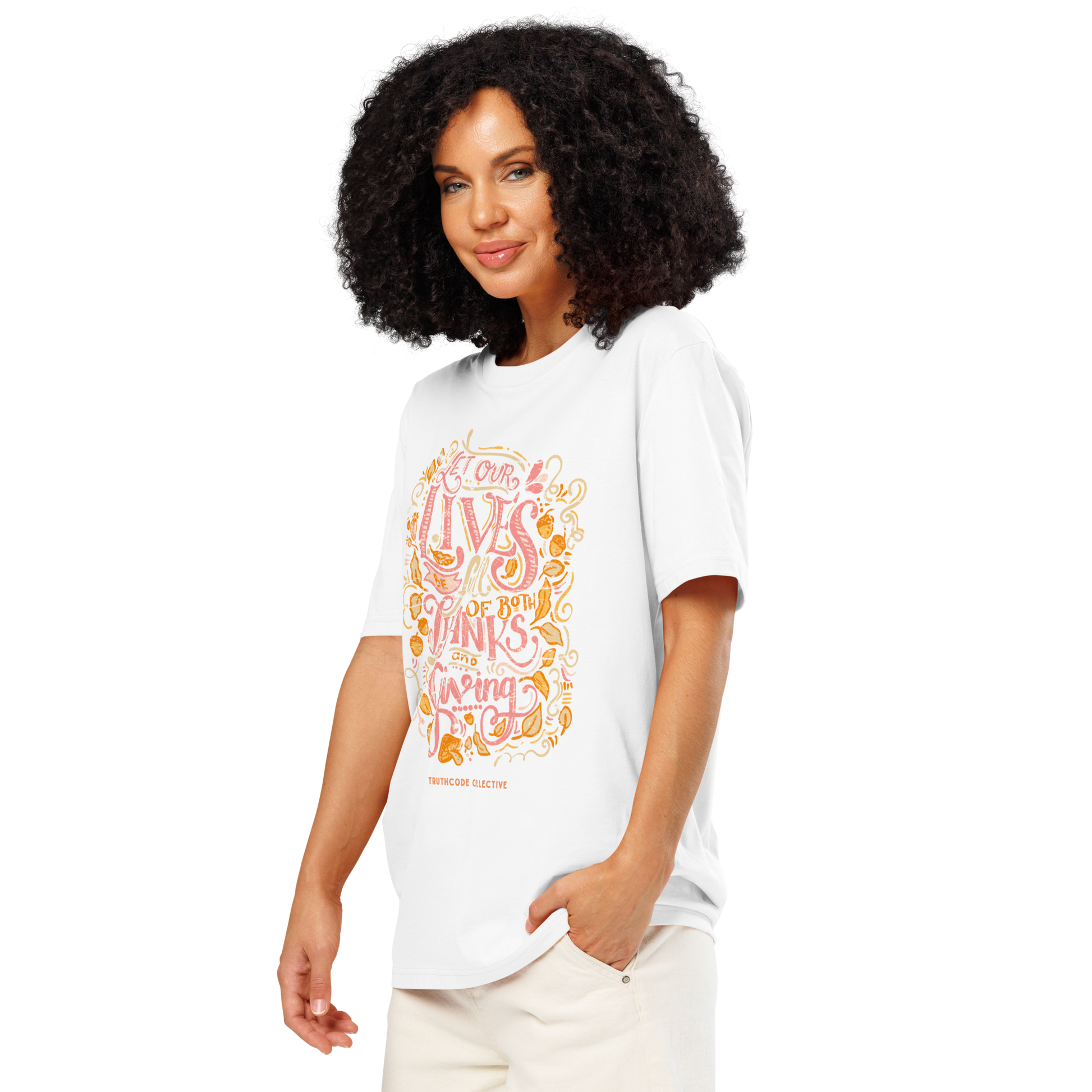Woman wearing white organic t-shirt with colorful text design 'Let our lives be full of both thanks and giving' on a white background