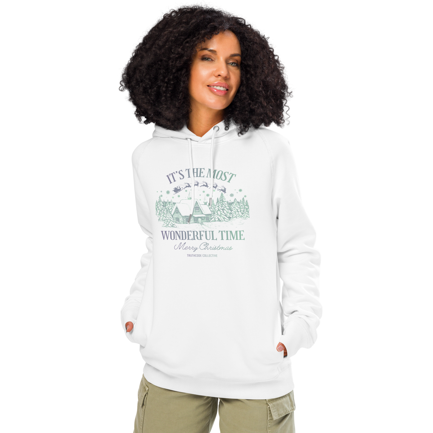 Woman wearing white organic hoodie with Christmas-themed design and text 'It's the most wonderful time of the year' on a white background