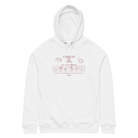 White organic hoodie with text 'Frequency of love' and laundry tag style graphics with symbols relating to love, on a white background