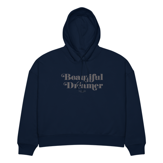 Navy blue organic hoodie with 'Beautiful Dreamer' text design, on a white background